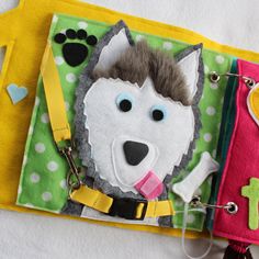 a small purse with a dog on it and a keychain attached to it