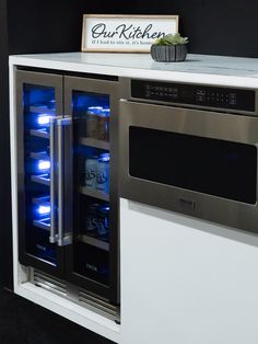 a stainless steel double door refrigerator with blue lights