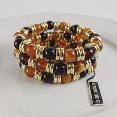 New Vintage! Gorgeous Genuine Lucite Bracelet With 3 Strands, Orange And Brown Lucite Beads With Gold Tone Spacer Beads. Please See Pictures For Details Condition And Measurements To Ensure Proper Fit. Thanks For Looking! Orange Aesthetic Jewelry, Orange Stackable Bracelets With Round Beads, Stackable Orange Round Beaded Bracelets, Adjustable Orange Stackable Beaded Bracelets, Adjustable Stackable Orange Beaded Bracelets, Orange Stackable Beaded Bracelets For Gifts, Orange Stackable Beaded Bracelets As Gift, Orange Stackable Jewelry With Round Beads, Orange Stackable Round Bead Jewelry