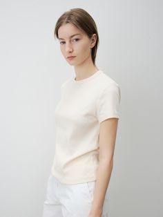 This is KLEAN’s made from durable, highly elastic fabric. With a minimalist design, it is versatile enough to pair with a variety of outfits. As a wardrobe essential, it has been crafted from strong materials and constructed with robust stitching to ensure minimal wear and tear even after long-term use and multiple washes. The fabric has been treated to remove lint, resulting in a clean and smooth texture. The neckline is reinforced with sturdy stitching to prevent deformation, and the shoulder seams feature silicone taping to prevent stretching. - Ideal for everyday wear- Pairs well with various bottoms to create diverse looks- A basic item that complements any outfit stylishly Fitted Minimalist Everyday T-shirt, Versatile Fitted T-shirt, Versatile Fitted Plain Tops, Classic Crew Neck High Stretch Tops, Plain Stretch Tops For Work, Stretch Plain Tops For Work, Fitted Versatile Plain Tops, Fitted Plain Versatile Tops, Fitted Beige Plain Top