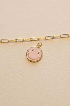 14k Gold filled Baby Pink Smiley Face Enamel Charm that adds joy to any chain. This charm adds a bit of happiness to every necklace. Hand make your custom charm necklace in Laguna Beach or build your piece online through adding a base necklace and your selection of charms. Leave us a note on your order for any special requests. 14K gold filled Tarnish resistant Enamel 14k Gold Filled Charms Jewelry With Round Pendant, 14k Gold-filled Charms Round Pendant Jewelry, 14k Gold Filled Round Pendant With Charms, Pink Gold Pendant Jewelry With Charms, 14k Gold-filled Round Pendant With Charms, Birthday Charm Pendant Necklaces, Best Friend Gift Pendant Charm Necklace With Adjustable Chain, Minimalist Charm Necklaces For Best Friend Gift, Birthday Charm Pendant Necklace