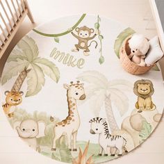 a baby's nursery rug with jungle animals and giraffes on it