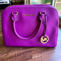 Michael Kors Saffiano Bag In Pomegranate. In Excellent Condition. Barley Ever Used It. No Signs Of Wear, No Stains. See Pictures . Originally $398. Beautiful Magenta Color. Luxury Purple Satchel With Gold-tone Hardware, Designer Purple Satchel For Shopping, Purple Crossbody Satchel With Gold-tone Hardware, Purple Shoulder Bag With Gold-tone Hardware For Shopping, Designer Purple Top Handle Satchel, Purple Satchel With Gold-tone Hardware For Travel, Designer Purple Bag With Gold-tone Hardware, Designer Purple Bags With Gold-tone Hardware, Luxury Purple Shoulder Bag For On-the-go