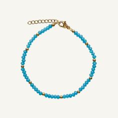 This beaded stacking bracelet, with its hues reminiscent of a clear summer day, radiates the beauty seen above. Its delicate beads blend shades of blue, from the palest morning sky to the deep azure of midday. Wear it alone for a subtle pop of color, or layer it with other pieces to craft your own personalized palette of shades. Its flexible design ensures comfort without compromise on style. Created with a stainless steel base and utilizing an extra luxurious 18 karat gold plating for the perfe Dainty Blue Bracelets With Faceted Beads, Dainty Blue Round Bead Bracelets, Blue Beaded Bracelets With Tiny Beads For Everyday, Everyday Blue Beaded Bracelets With Tiny Beads, Everyday Blue Bracelets With Spacer Beads, Everyday Blue Hand-strung Beaded Bracelets, Dainty Blue Beaded Bracelets With Faceted Beads, Blue Faceted Rondelle Bracelets, Dainty Blue Bracelets With Tiny Beads