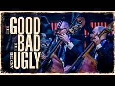 two men are playing instruments in front of an audience with the words good bad ugly