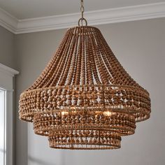 a wooden chandelier hanging from the ceiling