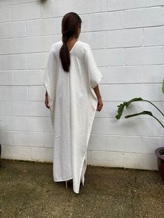 Embrace the gentle waves and sunny shores with our double gauze cotton kaftan. This versatile caftan falls gracefully between the knees or ankles, depending on the length you choose. It's the ultimate in loungewear for women - perfect as a beach dress or cover up. Crafted from light and airy double gauze cotton, it's your essential for a night on the town, a day by the sea, or just running errands. Cotton Kaftan Dress, Off White Dress, Cotton Caftan, Cotton Kaftan, Off White Dresses, Hang Loose, Caftan Dress, Double Gauze, Kaftan Dress