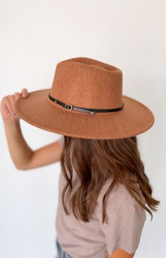 This wool wide brim hat with two interchangeable belts is the perfect addition to your wardrobe. Crafted from a wool blend, this stylish and timeless hat will elevate your look and give you a distinguished flair. Included with each hat are two belt color options: brown or black 10% wool, 90% polyester Brown Fall Hat Bands, Chic Adjustable Brown Fedora, Brown Wide Brim Felt Hat For Fall, Chic Brown Fedora With Curved Brim, Chic Brown Curved Brim Fedora, Adjustable Brown Fedora For Fall, Chic Brown Felt Hat For Winter, Chic Brown Wide Brim Felt Hat, Chic Winter Fedora For Rodeo