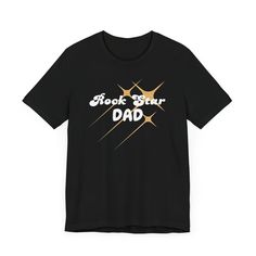 Celebrate the superstar in your life with our funny t-shirt for men, the Rock Star Dad t-shirt, a fun and stylish way to show appreciation for the coolest Dad around! Featuring a trendy shooting star design and playful text, this humorous men's t-shirt is sure to make him feel like the rock star he truly is. The bold and playful "Rock Star Dad" text is prominently displayed beneath the shooting star, making it clear who the true rock star is in your family. Crafted from comfortable and durable f Star Making, Shooting Star, Star Design, Rock Star, Man Humor, Mens Graphic Tee, Star Designs, Favorite Shirts, Leisure Wear