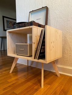 a wooden shelf with some books on top of it