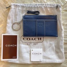 the coach wallet and keychain are on display