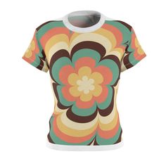 Step back in time with our groovy retro flower power shirt, a delightful homage to the vibrant fashion of the 60s and 70s. This women's fashion tee is inspired by the iconic and free-spirited era that brought us peace, love, and a whole lot of color! Crafted with an eye-catching design, this tee showcases a kaleidoscope of colorful flowers, reminiscent of the bold and psychedelic patterns that defined the flower power movement. The playful combination of vivid hues, from sunny yellows and earthy Retro Fitted Printed T-shirt, Retro Printed Summer T-shirt, Retro Short Sleeve Tops With Sublimation Print, Retro Short Sleeve Printed T-shirt, Retro Printed Short Sleeve T-shirt, Spring Retro Print Short Sleeve Tops, Retro Relaxed Fit T-shirt With Sublimation Print, Summer Tops With Retro Print And Relaxed Fit, Short Sleeve Top With Retro Print For Spring