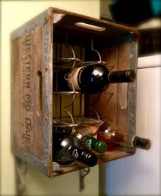 an old wooden box with wine bottles in it