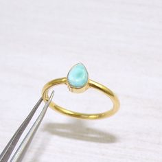 This handcrafted jewelry is made by Crystal Legacy . For each piece , we handpick the best gemstone and ensure high quality craftsmanship and intrinsic designing. Buy it for yourself of for your loved ones. Pear Larimar Ring, Ocean Blue Larimar Ring, Larimar Jewelry, Boho Ring, Casual Ring, Promise Ring, 18k Gold Plated Brass Ring, For Her, Gemstone - Natural Larimar  Weight - 3gm Stone Size -5x8mm Metal: Brass With 18k Gold Plated Each piece is ready in stock at our store in Vancouver, Canada. Larimar Turquoise Gemstone Ring For Anniversary, Handmade Turquoise Larimar Ring For Anniversary, Larimar Turquoise Ring Gift, Turquoise Larimar Ring Gift, Larimar Turquoise Ring Gemstone Gift, Gift Turquoise Larimar Ring, Casual Rings, Larimar Ring, Larimar Rings