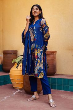 Blue kurta with hand painted fisherman kalamkari motifs and triangle lace detailing. Paired with a co-ordinating triangle lace detailing straight pant and dupatta with embroidered scallop border. - Aza Fashions Unstitched Bohemian Sets In Blue, Unstitched Blue Bohemian Sets, Blue Sets With Printed Motifs In Traditional Drape, Bollywood Blue Lawn Suit With Printed Motifs, Blue Bollywood Lawn Suit With Printed Motifs, Blue Bohemian Unstitched Sets, Blue Bohemian Sets Unstitched, Blue Chanderi Lawn Suit With Printed Motifs, Indigo Sets With Printed Motifs For Eid