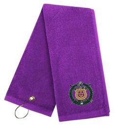 a purple towel with an emblem on it and a hook attached to the front of it