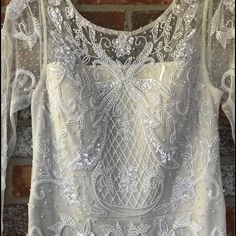 Brand New, Never Worn, Beaded Wedding Dress. Still Has Tags Attached! It’s A Size 4, And Hasn’t Been Altered At All. It Has Been Stored Safely In The Garment Bag From The Dress Shop The Whole Time. I Don’t Have A Need For It Anymore. Price Is Negotiable. Sequin Lace Mother Of The Bride Dress For Wedding, Wedding Dress With Beaded Fitted Bodice, Fitted Floor-length Wedding Dress With Pearl Embroidery, Formal White Wedding Dress With Pearl Embroidery, Floor-length Fitted Wedding Dress With Pearl Embroidery, White Embellished Mother Of The Bride Evening Dress, Formal White Sequined Wedding Dress, White Embellished Mother Of The Bride Dress For Evening, Embellished White Mother Of The Bride Dress For Party