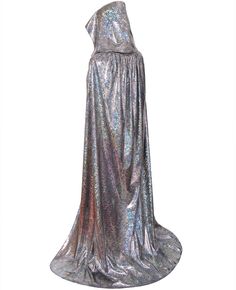 a woman wearing a silver dress and cape