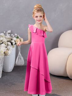 Elevate the elegance of your bridal party with our One Shoulder Ruffles Chiffon Junior Bridesmaid Dresses. Delicate chiffon and romantic ruffle details create a stylish and timeless look. Perfect for a junior bridesmaid, this one-shoulder dress is both modern and classic. Chiffon Ruffles Bridesmaid Dress For Wedding, Chiffon Bridesmaid Dress With Ruffles For Wedding, Pink Bridesmaid Dress With Ruffles, Floor-length Ruffled Bridesmaid Dress For Party, Solid Color Gown For Wedding And Prom Season, Gown For Wedding And Prom Season, Wedding Gown For Prom Season, Floor-length Gown For Bridesmaids, Solid Floor-length Gown For Bridesmaid