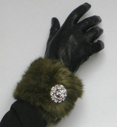 Genuine Vintage Rabbit Fur  (70's) pieces from Milano, handmade  pair of cuffs embellished with a pair of hand made brooch - Cufflinks made from rhinestones (1.5 Inches in diameter). The adjustable cuffs are fitted with 2 magnetic press dud fasteners so as to be worn either as a bracelet (one size) or as cuffs on a jacket a coat or dress (larger size). See photo above. The magnificent forest green hue of this long hair rabbit fur give it a truly vintage appeal    Dress up your little black dress or vintage jacket. Fully lined. Length: 12 Inches  30 cm Width:   4 Inches    10cm Classic Cuff Jewelry For Party, Vintage Cuff Bracelet For Party, Handmade Formal Brooches, Handmade Round Brooch For Formal Events, Faux Fur Stole, Fur Cuffs, Fabulous Furs, Fur Accessories, Vintage Rabbit