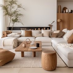 a living room filled with lots of white furniture