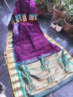 This is a beautiful wine / plum colour Handloom Gadwal saree .  Gadwal sari is a handcrafted woven sari style in Gadwal of Jogulamba Gadwal district in the Indian state of Telangana. They are most notable for the Zari on the saris. The sari consists of cotton and silk thread woven body with silk pallu which is also given a new name as Sico saris. The saree is traditionally woven in the interlocked-weft technique, called Kupadam or Kuttu. This saree is unique in colour combination. If you want can make the blouse also with extra charges . In Case of stitching Blouse all you need to check my listing .  IMPORTANT :- kindly provide your Mobile No & EMAIL ID as it is mandatory for standard shipping Services to ship article. * Fall Edging complimentary . Bollywood Style Purple Art Silk Pre-draped Saree, Purple Art Silk Pre-draped Saree With Self Design, Purple Self-design Pre-draped Saree For Puja, Purple Handloom Pre-draped Saree For Puja, Bollywood Style Purple Handloom Pre-draped Saree, Purple Handloom Pre-draped Saree For Diwali, Traditional Purple Pre-draped Saree For Puja, Purple Pre-draped Saree For Puja, Traditional Purple Pre-draped Saree