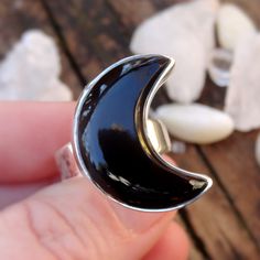 "☾Handmade, Natural Black Onyx Sterling Silver Moon Statement Rings☾ ❤︎Featured in this listing is a sterling silver, handmade, natural stone ring. This lovely ring features a beautiful, Natural Black Onyx Large Moon shaped stone. The Black Onyx Moon has been bezel set into a highly polished, Sterling Silver, sturdy setting. ❤︎Wide gradual band from 4-6mm ❤︎These large 1\" Moons in black onyx have been highly polished, with a rise of 7mm ❤︎Each ring has been hand made, so may vary slightly Stone Unique Black Jewelry With Moon Phase, Unique Black Moon Phase Jewelry, Mystical Black Sterling Silver Rings, Mystical Black Ring As Gift, Celestial Black Sterling Silver Jewelry, Black Sterling Silver Celestial Jewelry, Black Sterling Silver Moon Phase Jewelry, Black Moonstone Gemstone Ring, Black Sterling Silver Jewelry With Moon Phase