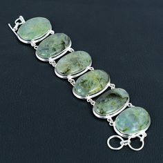 Welcome to kirtijewelsdesigns Natural Prehnite Gemstone Bracelet-925 Sterling Silver jewelry-Adjustable Bracelet-Handmade Jewelry-designer Bracelet Wedding gift for Her *The most unique jewelry you can find, a perfect gift for you and your loved one PRODUCT INFORMATION * Gemstone : Prehnite * Main Stone Creation : natural * Stone Shape : Same As Picture * Stone Category : Cabochon * Stone Polish : High * Bracelet Size : 7-8 Inch * Metal : 925 Sterling Silver * Purity : 925 Parts Per 1000 * Silve Bracelets Design, Bracelet Wedding, Wedding Bracelet, Adjustable Bracelet, Gemstone Bracelet, 925 Sterling Silver Jewelry, Bracelet Sizes, Charm Bracelets, Bracelet Designs