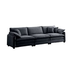 a black couch sitting on top of a white floor