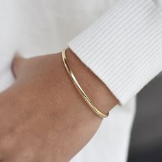 "14K solid gold cuff bracelet The bracelet will be shipped in a gift box * 14K solid gold. It is about 3.25mm width. Please select the size of your wrist.  If your wrist is 6\", please purchase a 6.25\" or 6.5\"bracelet. (If you order a 6\" bracelet, actual cuff length will be 5\" plus 1 inch opening.)" Luxury Adjustable Minimalist Cuff Bracelet, Classic Yellow Gold Cuff Bracelet, Tarnish Resistant, Timeless 14k Gold Cuff Bracelet, Tarnish Resistant, Yellow Gold Tarnish-resistant Cuff Bracelet For Everyday, Timeless 14k Gold Cuff Bracelet Tarnish Resistant, Classic Rose Gold Bangle For Everyday Wear, Classic Rose Gold Bangle For Everyday, Minimalist Gold Bracelet With Polished Finish For Everyday Luxury, Minimalist Open Cuff Bangle For Gift