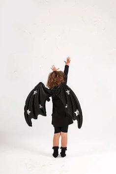 This awesome black bat wings with holographic stars foil balloon will give your little one a spooky look for your Halloween party. Foil balloon in the shape of bat wings, with strings to attach to the back. Black Matte with holographic stars. Approx. dimensions 85 x 50 cm.  To be inflated with air. Includes a straw. Ships flat and deflated for safe delivery. Why not have a look at our other Halloween decorations? You only have to pay postage for your first item, after that you get FREE postage o Wings Halloween Costume, Kids Bat, Bat Halloween Costume, Halloween Party Costume, Black Bat, Halloween Party Costumes, Halloween Costume Ideas, Fete Halloween, Halloween Kostüm