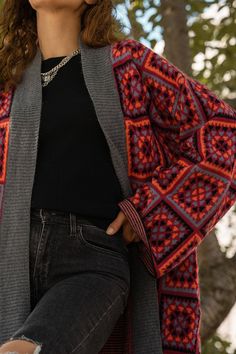 This Saachi Knitted Square Patch Kimono Sweater in Red was inspired by the best-selling Saachi Granny Square Crochet Kimonos. This kimono sweater features a similar Granny patch pattern on a more substantial knit sweater. Multicolor granny square patches are knit onto a red background. The inner sweater has horizontal striping that contrasts the outer patch perfectly. Created from 100% acrylic with a wool-like feel, this sweater will keep you cozy! Layer this kimono for more warmth or wear with Oversized Red Cardigan For Fall, Fall Oversized Red Cardigan, Fall Patchwork Sweater One Size, Red Knit Sweater Coat For Winter, One-size Patchwork Sweater For Fall, Red Fair Isle Long Sleeve Outerwear, One Size Red Winter Cardigan, Knit Patchwork Cardigan For Fall, Red Fair Isle Pattern Cardigan For Fall