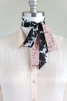 "Black, white, and pink neck scarf in a shadow bouquet/face print mix. Ready to ship, special edition midi-length skinny scarf designed by Cinne. Full of character with endless styling possibilities. Wear around your neck, in your hair, tied on your favorite bag, or around your wrist. Find more styling examples in second to last photo. Constructed entirely by hand with love and attention to every detail. . . . . . . . . . . . . . . . . . . . . . . . . . . . . . . . . . . . . . . . . . . . . . . Chic Black Silk Scarf Gift, Black Silk Scarf For Spring Gift, Black Silk Scarf As Summer Gift, Black Silk Scarf For Summer Gift, Trendy Scarves For Spring Workwear, Trendy Spring Scarves For Workwear, Trendy Spring Scarves, Trendy Scarves With Ties For Spring, Trendy Spring Scarves With Ties