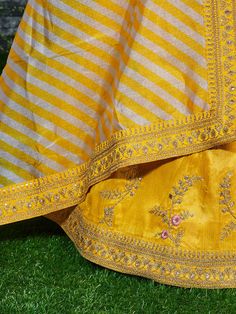 Introducing our stunning "yellow embroidery mulberry silk wedding lehenga choli" - a must-have addition to any modern woman's wardrobe. Made from high-quality mulberry silk material, this lehenga exudes elegance and sophistication. With its yellow color, it is perfect for upcoming functions, weddings, receptions, and other special occasions.
One of the key benefits of this lehenga is its intricate craftsmanship. The dori work, zari work, embroidery work, thread, and glitter sequin work add a tou Unstitched Raw Silk Lehenga With Gota Work, Yellow Embroidered Kundan Sets, Designer Yellow Kundan Sets, Yellow Chanderi Choli With Traditional Drape, Traditional Drape Yellow Chanderi Choli, Designer Yellow Chanderi Choli, Yellow Saree Set With Zari Work, Gold Raw Silk Lehenga With Dori Work, Gold Lehenga With Dori Work In Raw Silk