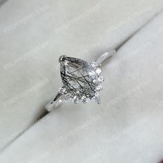 an engagement ring with a fancy cut diamond