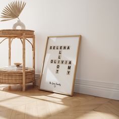 a wooden table sitting next to a white wall with an eye chart on it and a wicker basket