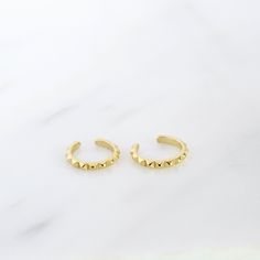 "Simple and dainty ear cuff - a perfect piece to add a subtle detail to the top of your ear without the need for a piercing. Both tiny and versatile, this delicate ear cuff is perfect to mix and match with other earrings. ♦ Sold individually (1 ear cuff) or as a pair (2 ear cuffs) * D E T A I L S * ∙ Material: .925 Sterling Silver or 18K Gold Plated over .925 Sterling Silver ∙ Diameter: 8mm ∙ Fit: Slide ear cuff onto the top of your ear, then move to the desired position & squeeze gently for a s Trendy Gold Pierced Ear Cuff, Adjustable Gold Pierced Ear Cuff, Trendy Yellow Gold Pierced Cartilage Earrings, Trendy Adjustable Gold Cartilage Earrings, Gold Open Ring Cartilage Earrings, Gold Dainty Ear Cuff, Dainty Gold Pierced Ear Cuff, Adjustable Single Gold Cartilage Earring, Adjustable Gold Nickel-free Ear Climbers