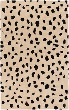 an animal print rug with black spots on it