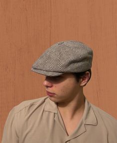 Elevate your winter wardrobe with our Brown & Gray Herringbone Cap, a vintage-inspired masterpiece that effortlessly blends Peaky Blinders style with Gatsby sophistication. Handmade with care, this 8 panels cap is not just an accessory; it's a statement piece that resonates with classic charm. Discover The Versatility Of Our Hat: -Classic herringbone pattern for a timeless look -Handmade with high-quality wool for warmth and durability -Versatile newsboy cap suitable for winter fashion -Gatsby style hat with a touch of vintage elegance -Ideal cabbie hat for a dapper and stylish appearance -Perfect for men seeking both style and warmth Embrace the coziness of the season with our warm wool hat collection. This brown newsboy cap, a baker boy hat with hooligan beret elements, is a unique and t Winter Classic Baseball Cap With Short Brim, Classic Adjustable Baseball Cap For Fall, Classic Winter Hat With Visor, Classic Flat Cap Baseball Hat For Fall, Classic Flat Cap Baseball Cap For Fall, Classic Winter Visor Hat, Retro Short Brim Hats For Fall, Classic Fall Flat Cap Baseball Cap, Retro Short Brim Fall Hat