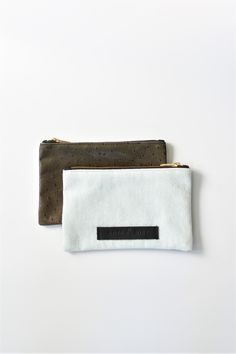 The limited-edition Redding pouch combines some of our favorite things - design, versatility, function and of course, beautiful materials. The pouch can be used as a clutch on its own or coordinates seamlessly with any one of our bags to keep things tidy and organized. Every pouch is handmade in the USA and finished with a brass zipper pull and our signature leather logo patch. Front: Bleached DenimBack: Fern Colored Embossed Leather Skin Content:- Leather and Denim- Made in the USA- Quantities Minimalist Rectangular On-the-go Pouch, Rectangular Pouch With Laptop Sleeve, Everyday Rectangular Pouch With Laptop Sleeve, Rectangular Everyday Pouch With Laptop Sleeve, Versatile Everyday Pencil Case Pouch, Modern Pencil Case With Removable Pouch, Rectangular Laptop Pouch, Beige Zipper Pouch Clutch, Everyday Pouch With Laptop Sleeve