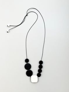 Minimal necklace of wooden elements in black and elements of polymer clay in white. The central element has a size of 3 cm (1.2 ") and is made of polymer clay in glitter white. The length can be adjusted. A wonderful accent for your outfit. FREE SHIPPING! My other listings: https://www.etsy.com/shop/InchiWork?ref=seller-platform-mcnav Indicative delivery times: Europe: 5-8 working days USA, Canada: 7-14 business days Follow me on instagram, facebook and pinterest for more pictures and ideas. htt White Jewelry With Adjustable Cord For Everyday, Black Long Necklace With Adjustable Length, Everyday Adjustable White Necklaces, Everyday Adjustable White Necklace, Minimalist White Long Necklace, Minimalist Long White Necklace, Elegant Black Necklace With Adjustable Cord, Minimalist Wooden Beads Jewelry Gift, Adjustable Black Jewelry With Wooden Beads