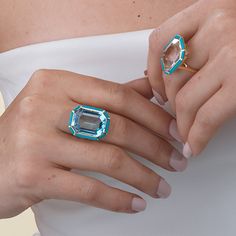 JR0365-BT 'Mélange' Blue Topaz with Lapis Lazuli & Turquoise Inlay Emerald Cut Ring in 18K Gold Stone Size: 19.2 x 14.2 mm Approx. Stone Wt: 21.16 Carats (Blue Topaz) Luxury Turquoise Gemstone Ring, Luxury Blue Turquoise Ring For Wedding, Luxury Blue Multi-stone Topaz Ring, Luxury Blue Turquoise Ring For Formal Occasions, Luxury Blue Gemstones For Formal Occasions, Luxury Turquoise Ring Jewelry, Formal Turquoise Multi-stone Rings, Blue Luxury Rings With Gemstone Accents, Luxury Blue Multi-stone Turquoise Ring