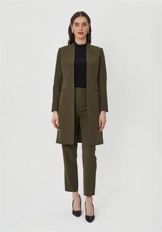 Elevate your wardrobe with this sophisticated olive green women's suit set. Featuring a sleek longline blazer and matching tailored trousers, this suit offers a refined silhouette perfect for both professional and special occasions. The minimalist design is enhanced by clean lines and a flattering fit, ensuring you make a lasting impression. Whether you're heading to a business meeting or a formal event, this suit provides the perfect balance of elegance and confidence. Elegant Olive Outerwear For Formal Occasions, Elegant Olive Formal Outerwear, Elegant Khaki Blazer For Office, Tailored Khaki Blazer For Work, Elegant Green Outerwear For Work, Elegant Green Pantsuit For Office, Green Tailored Business Casual Pantsuit, Tailored Green Pantsuit For Business Casual, Elegant Green Pantsuit