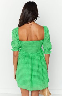 * Green Babydoll Dress  
 * Stand out in this gorg mini dress! Dress up with heels () and jewellery () for cocktails OR with sneakers () for a Sunday brunch.  
 * 
 
 * Mini length  
 * Elasticated puff sleeves  
 * Square or off the shoulder neckline  
 * Elasticated band at back  
 * Lined  
 * Checkered green pattern  
 * Mid weight material with no stretch  
 * A line shaped skirt Trendy Green A-line Mini Dress, Green A-line Mini Dress For Casual Occasions, Trendy Green Mini Dress With Square Neck, Green A-line Mini Dress For Day Out, Green A-line Mini Dress For Date Night, Green Mini Dress With Square Neck For Party, Green Square Neck Mini Dress For Party, Green Square Neck Flirty Dress, Trendy Green Mini Dress For Brunch