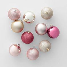 an assortment of different colored ornaments on a white background with space for text or image