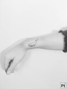 a black and white photo of a person's arm with a banana tattoo on it