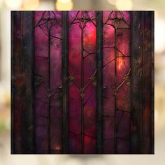 an image of a stained glass window with vines on it