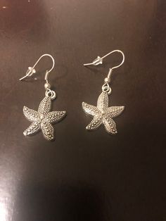 These silver earrings are beautiful starfish. The starfish are about 1 inch long.  Great gift for a loved one, that special starfish. Silver Ocean-inspired Earrings, Nickel-free Silver Ocean-inspired Earrings, Beach Star Charm Earrings, Star-shaped Earrings With Star Charm For Beach, Beach Earrings With Star Charm, Star Shaped Earrings With Star Charm For Beach, Silver Star-shaped Pierced Earrings, Star-shaped Earrings For Beach With Pierced Ears, Silver Star-shaped Earrings With Ear Wire