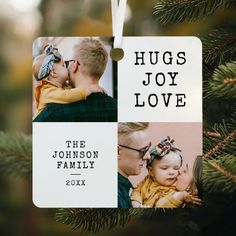 a christmas ornament hanging from a tree with two photos and the words hugs joy love