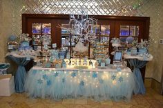 a table covered in blue and white decorations